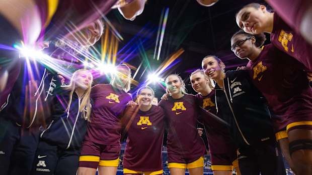 The Gophers huddle before their win over Michigan.